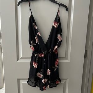 Audrey 3+1 boutique romper. Size small. Black with pink and red floral